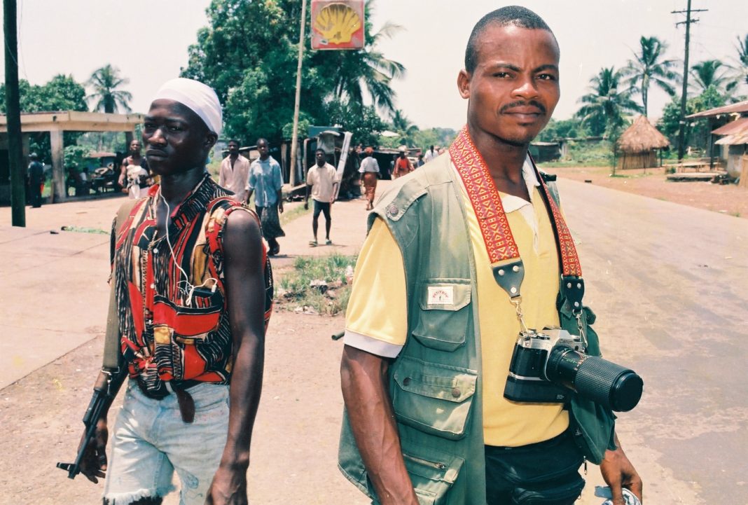 Award-winning journalist/former war correspondent, James Kokulo Fasuekoi is seen in this undated photograph in the Liberian highway town of Kakata, where the Booker T. Washington Institute, BWI (a vocational center is located), after a gun battle between Taylor's forces and fighters of Roosevelt Johnson's ULIMO-J. Photo: Alex
