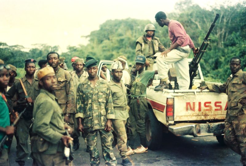 In this 1992 filed photograph across the Po River Bridge, near Combat Camp, ULIMO rebel fighters showed off a heavy weaponry they captured from Taylor's NPFL forces during the battle over Tubmanburg in western Liberia. Photo: James K. Fasuekoi/The AfricaPaper