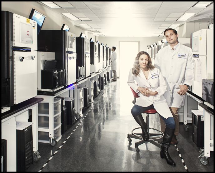 Pardis Sabeti and Stephen Gire in the Genomics Platform of the Broad Institute of M.I.T. and Harvard, in Cambridge, Massachusetts. They have been working to sequence Ebolaâ€™s genome and track its mutations.Credit Photograph by Dan Winters 