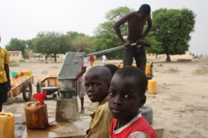 Boys pump water on the campus of the girls' secondary school in Chibok. Photo: Chika Oduah/TAP)