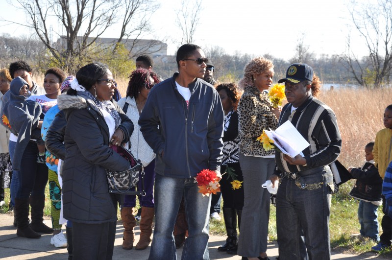 Timothy Borbor (with red flower), McCabe's brother at the vigil. Photo: The AfricaPaper/Issa A. Mansaray  