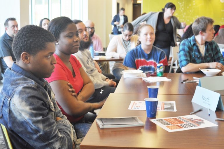 A group of people sitting at a table.
