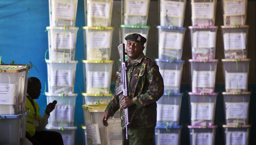 Police guarding ballot boxes after voting exercise