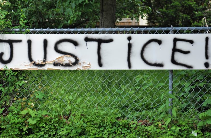 A fence with the word justice written on it.