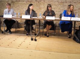 A group of people sitting at a table.